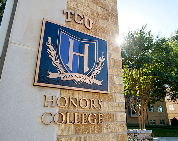 TCU John V. Roach Honors College sign outside Milton Daniel Hall, the Honors residence hall